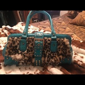 Kathy Van Zeeland leopard and turquoise bag